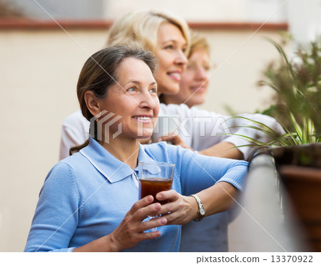 Woman friends on summer terrace 13370922