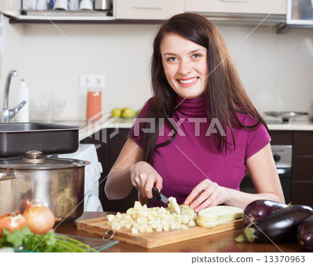 woman cutting the eggplant woman cutting the eggplant 13370963