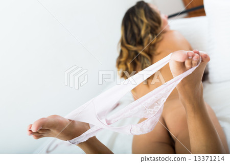 Nude woman posing on bed 13371214