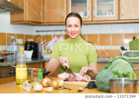 Housewife cooking at kitchen Housewife cooking at kitchen 13371394