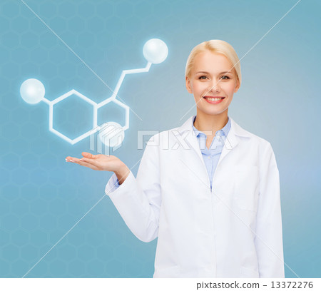 smiling female doctor pointing to molecule smiling female doctor pointing to molecule 13372276