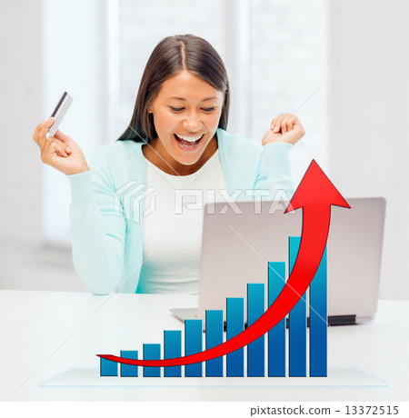 smiling woman with laptop computer and credit card 13372515