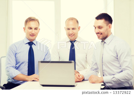 business team working with laptop in office 13372922
