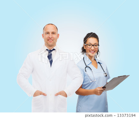smiling doctors with clipboard and stethoscopes 13373194