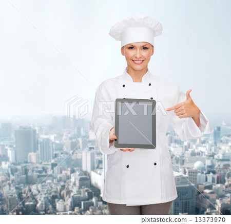 smiling female chef with tablet pc blank screen 13373970