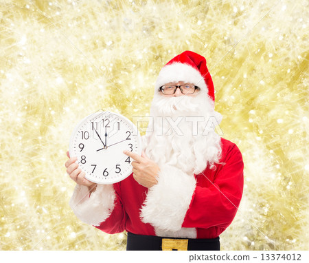 man in costume of santa claus with clock 13374012