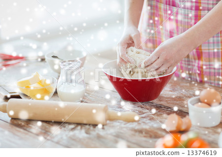 close up of female hands kneading dough at home close up of female hands kneading dough at home 13374619