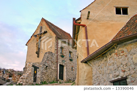 cross with a crucifix on a brick wall cross with a crucifix on a brick wall 13390046