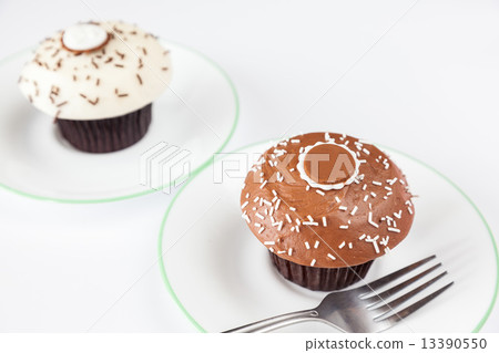 closeup chocolate cupcake with white sprinkle and fork closeup chocolate cupcake with white sprinkle and fork 13390550