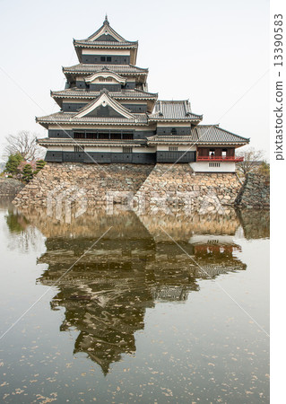 Matsumoto Castle in Japan in cloudy day Matsumoto Castle in Japan in cloudy day 13390583