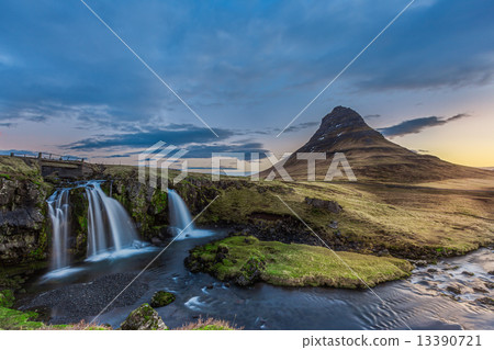 kirkjufellsfoss waterfall and kirkjufell mountain in the morning 13390721