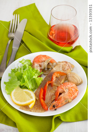 fish with seafood on the plate and glass of wine fish with seafood on the plate and glass of wine 13393931