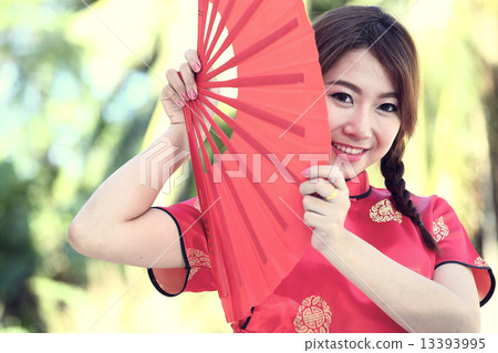 Chinese girl with dress traditional Cheongsam 13393995