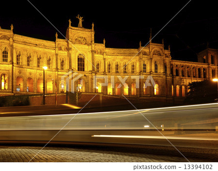 Munich - Maximilianeum at night with rays from a street car 13394102