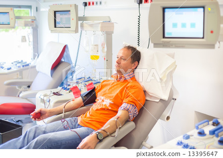 Blood donor at donation. Blood donor at donation. 13395647