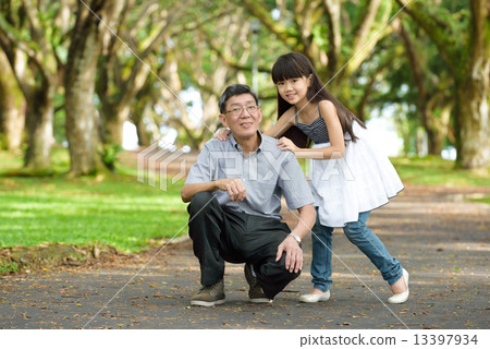 Chinese granddaughter and grandfather in the park 13397934
