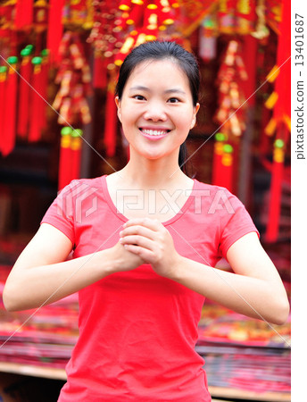 young asian woman wishing you a happy chinese new year young asian woman wishing you a happy chinese new year 13401687