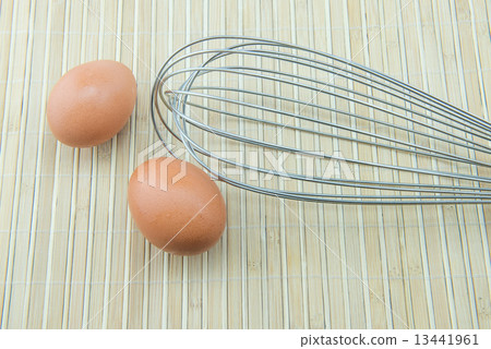close up of meat whisk and eggs close up of meat whisk and eggs 13441961