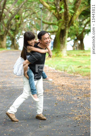 Chinese father and daughter playing in the park Chinese father and daughter playing in the park 13443811