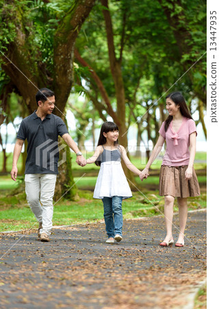 1 happy chinese family walking in the park 1 happy chinese family walking in the park 13447935