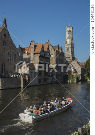 Dijver Canal and tour boat in Bruges, Belgium Dijver Canal and tour boat in Bruges, Belgium 13448136