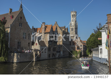 Dijver Canal and tour boat in Bruges, Belgium 13448137