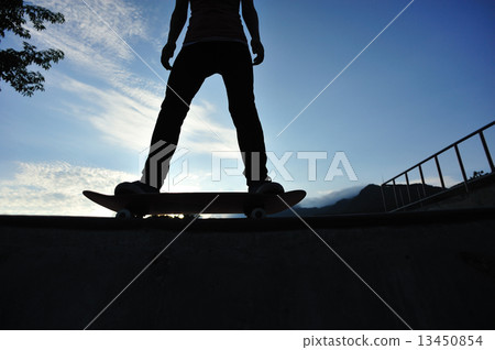 skateboarding woman at sunrise skatepark skateboarding woman at sunrise skatepark 13450854