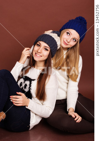 Two teenager girls friends in winter clothes Two teenager girls friends in winter clothes 13452756