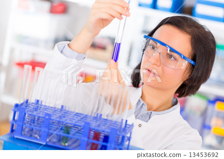 Woman with test tube 13453692