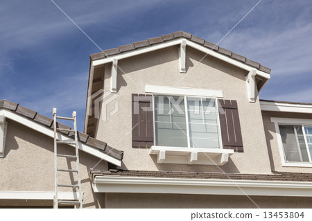 Ladder Leaning Up Against A Freshly Painted Home Ladder Leaning Up Against A Freshly Painted Home 13453804