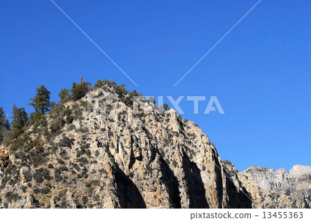 Cliff against blue sky 13455363