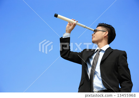 Businessman with telescope looking forward 13455968