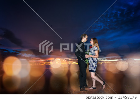 Couple in dating on sunset and abstract background 13458179
