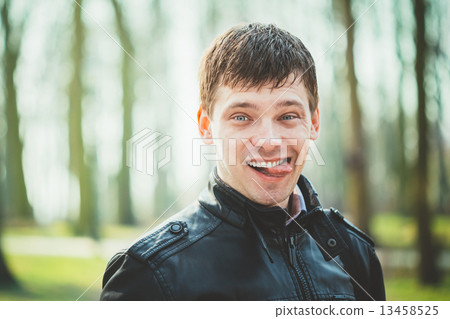 Close Up Young Handsome Man Shows Tongue. Close Up Young Handsome Man Shows Tongue. 13458525