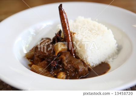 Beef curry with rice , Thai food on wood background Beef curry with rice , Thai food on wood background 13458720