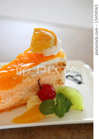 Orange cake on wood background Orange cake on wood background 13459563