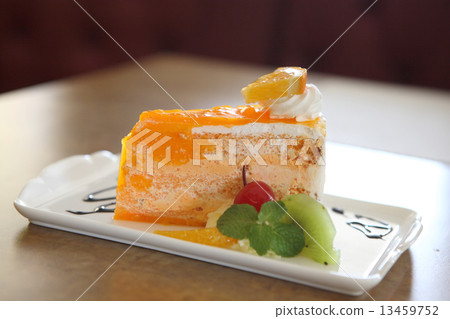 Orange cake on wood background 13459752