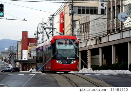Tramway train going through the streets of the Manyo line Takaoka city Tramway train going through the streets of the Manyo line Takaoka city 13461320