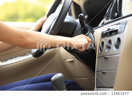 woman driver starting the car engine woman driver starting the car engine 13461877