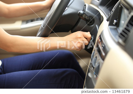 woman driver starting the car engine woman driver starting the car engine 13461879