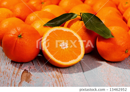 Ripe orange fruit on wooden board as background Ripe orange fruit on wooden board as background 13462952