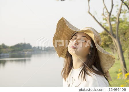 Asian women Looks cute cheeky & happy 13464406