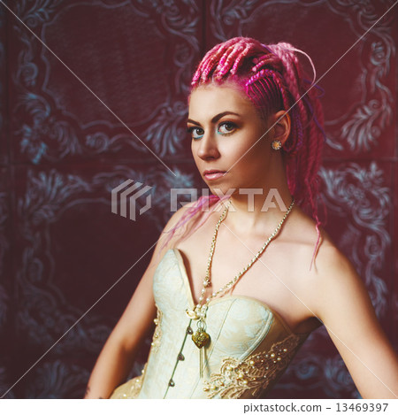 Freaky young female model wearing corset Freaky young female model wearing corset 13469397