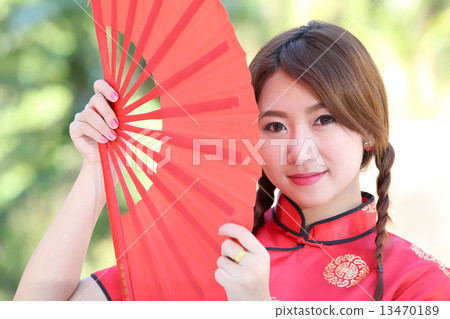 Chinese girl with dress traditional Cheongsam 13470189