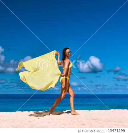 Woman with sarong at beach Woman with sarong at beach 13471299