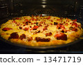 Pizza baking in oven 13471719