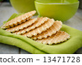Waffles on a green table napkin closeup 13471728