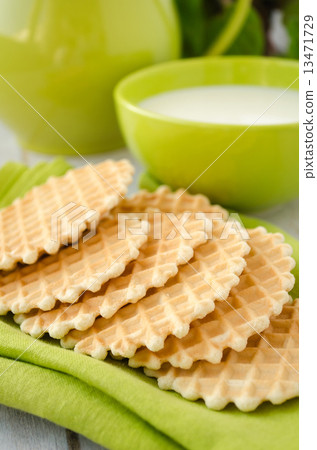 Waffles on a green table napkin closeup 13471729