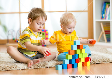 Kids playing in children room 13472108