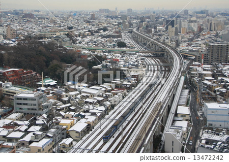 Sleeping Limited Express Hokutosei going through the city where the residual snow remains 13472242
